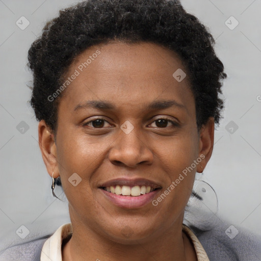 Joyful black young-adult female with short  brown hair and brown eyes