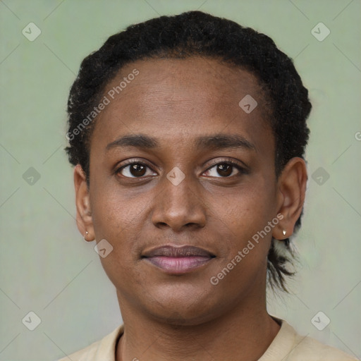 Joyful black young-adult male with short  brown hair and brown eyes