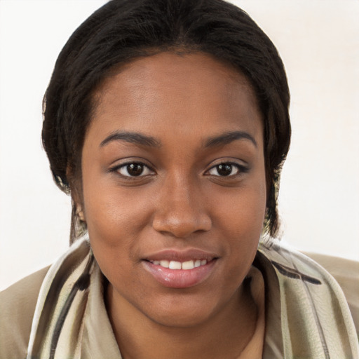 Joyful black young-adult female with long  brown hair and brown eyes