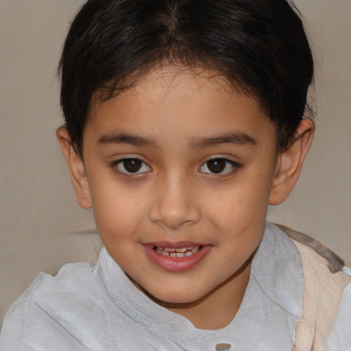 Joyful white child female with short  brown hair and brown eyes