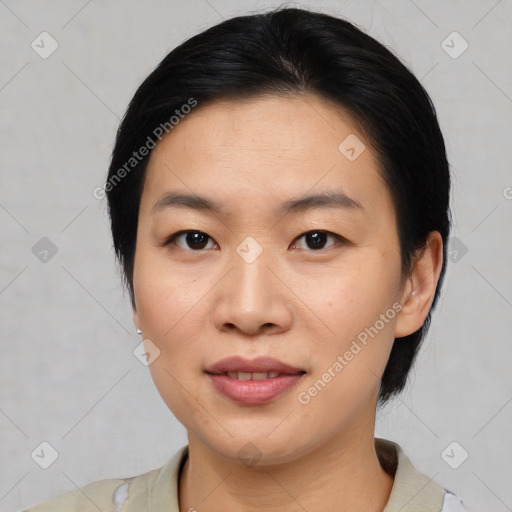 Joyful asian young-adult female with medium  black hair and brown eyes