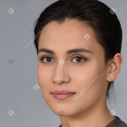 Joyful white young-adult female with medium  brown hair and brown eyes