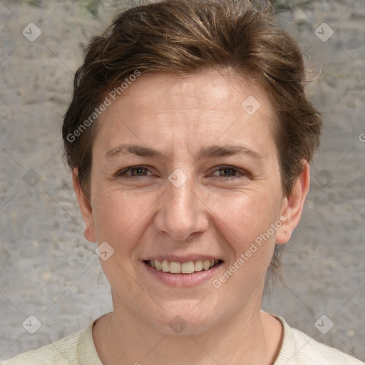 Joyful white adult female with short  brown hair and grey eyes