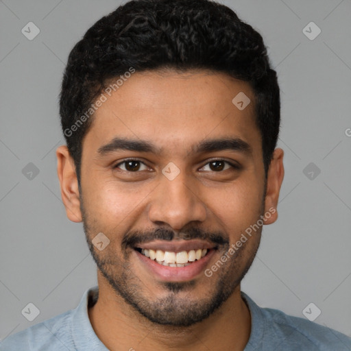 Joyful latino young-adult male with short  black hair and brown eyes