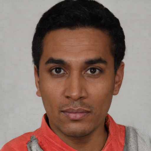 Neutral latino young-adult male with short  black hair and brown eyes