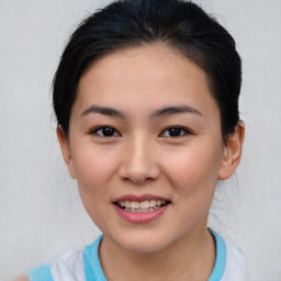 Joyful asian young-adult female with medium  brown hair and brown eyes