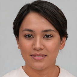 Joyful asian young-adult female with short  brown hair and brown eyes