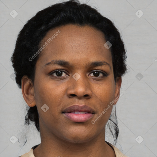 Joyful black young-adult female with short  black hair and brown eyes