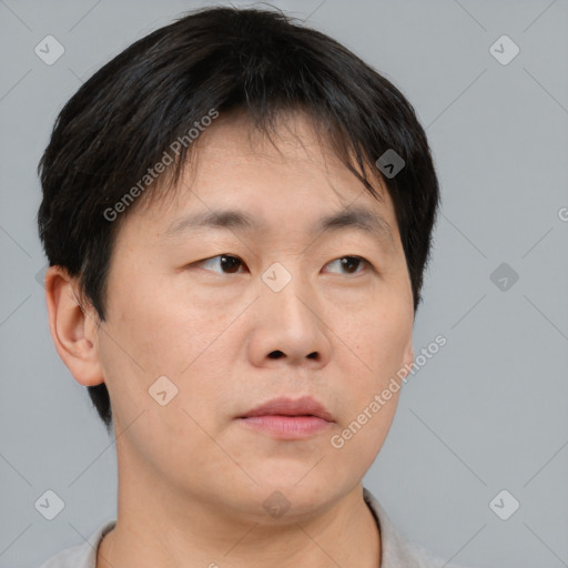 Neutral asian young-adult male with short  brown hair and brown eyes