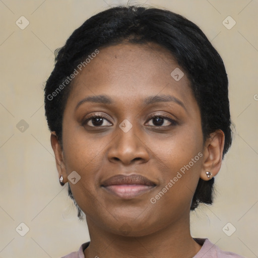 Joyful black young-adult female with medium  black hair and brown eyes