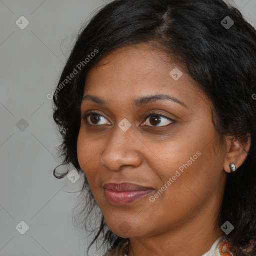 Joyful black young-adult female with medium  brown hair and brown eyes