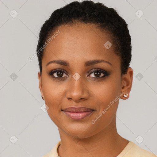 Joyful black young-adult female with short  brown hair and brown eyes