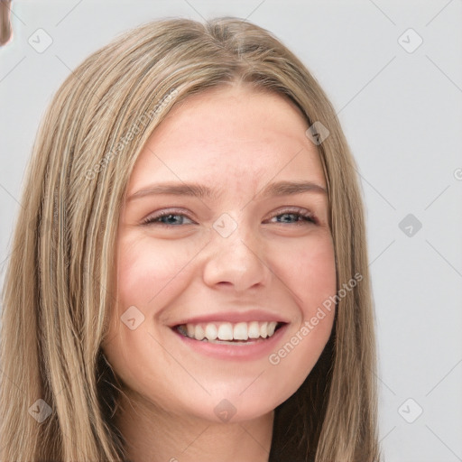 Joyful white young-adult female with long  brown hair and grey eyes