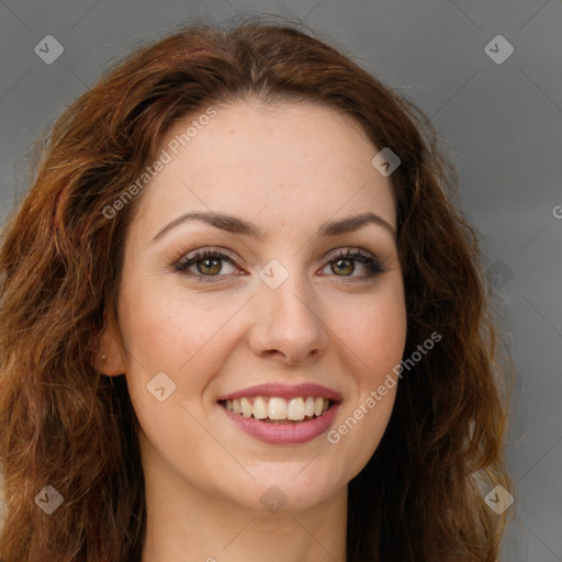 Joyful white young-adult female with long  brown hair and green eyes