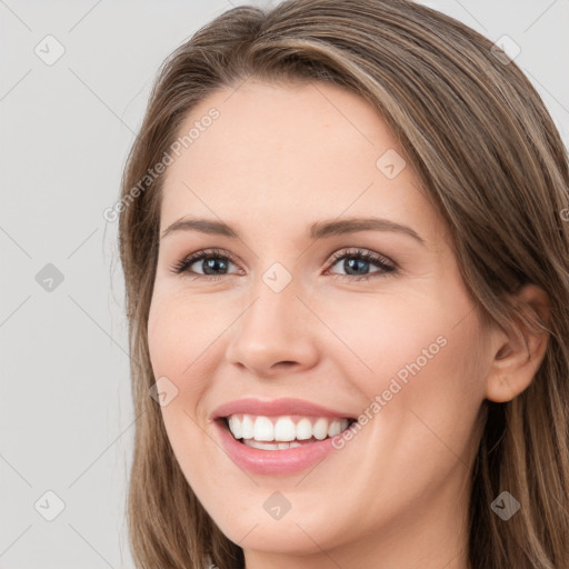 Joyful white young-adult female with long  brown hair and grey eyes