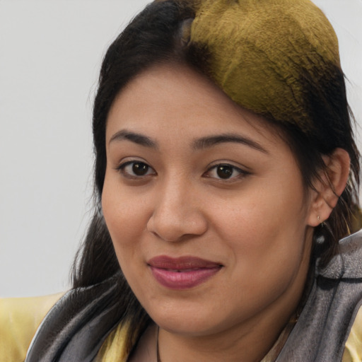 Joyful asian young-adult female with long  brown hair and brown eyes