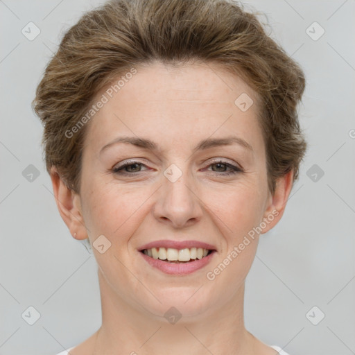 Joyful white young-adult female with short  brown hair and grey eyes