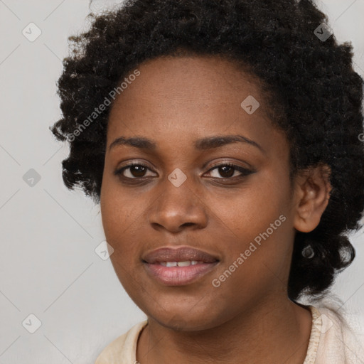 Joyful black young-adult female with long  black hair and brown eyes