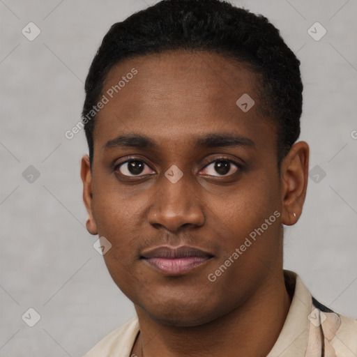 Joyful black young-adult male with short  black hair and brown eyes