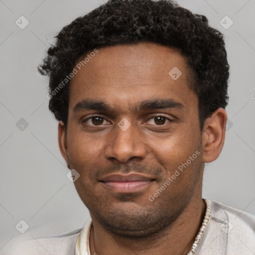 Joyful black young-adult male with short  black hair and brown eyes