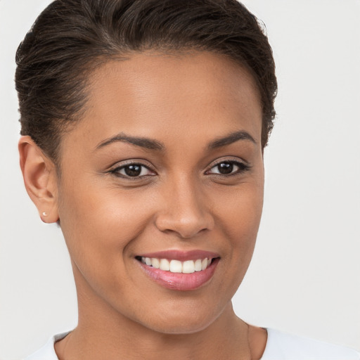 Joyful white young-adult female with short  brown hair and brown eyes