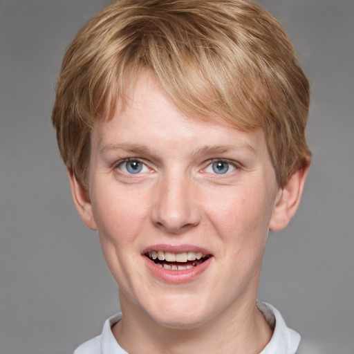 Joyful white young-adult male with short  brown hair and blue eyes