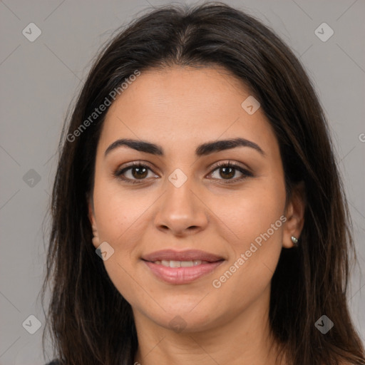 Joyful white young-adult female with long  brown hair and brown eyes