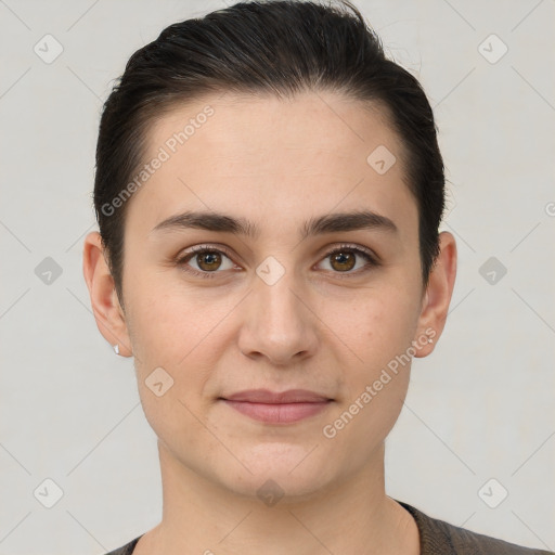 Joyful white young-adult female with short  brown hair and brown eyes