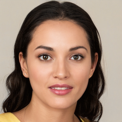 Joyful white young-adult female with medium  brown hair and brown eyes