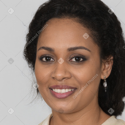 Joyful black young-adult female with medium  brown hair and brown eyes