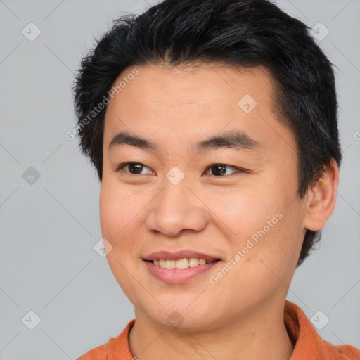 Joyful asian young-adult male with short  brown hair and brown eyes