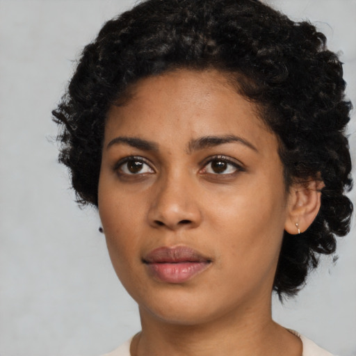 Neutral latino young-adult female with short  black hair and brown eyes