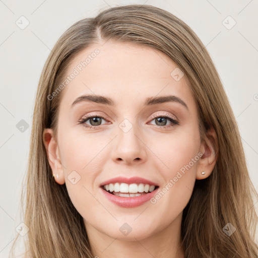 Joyful white young-adult female with long  brown hair and green eyes