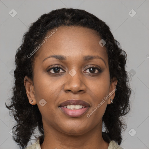 Joyful black young-adult female with medium  brown hair and brown eyes