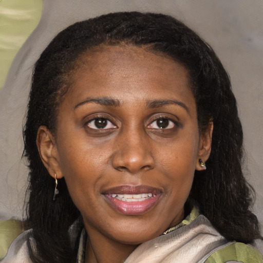 Joyful black young-adult female with medium  brown hair and brown eyes
