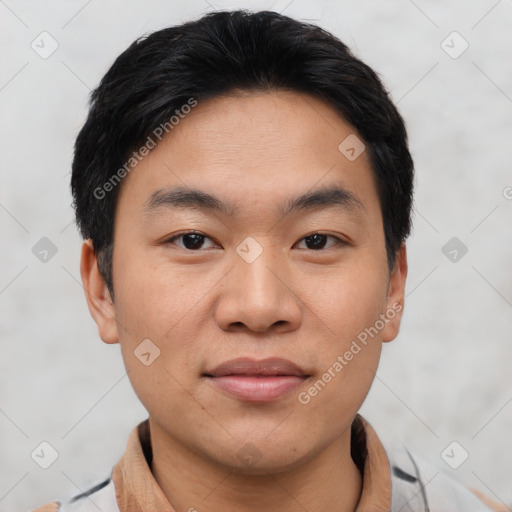 Joyful asian young-adult male with short  black hair and brown eyes