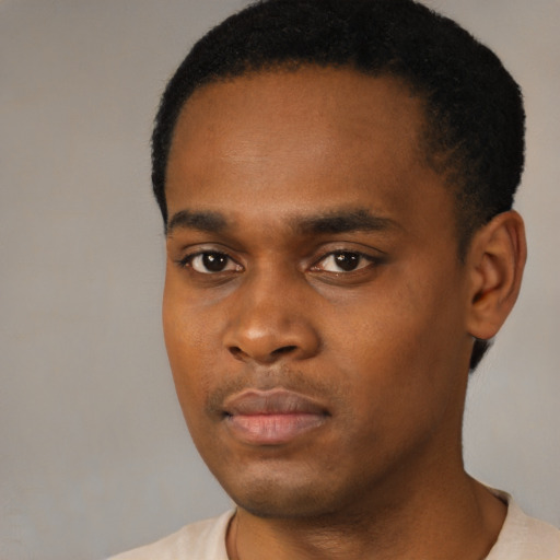 Neutral black young-adult male with short  black hair and brown eyes
