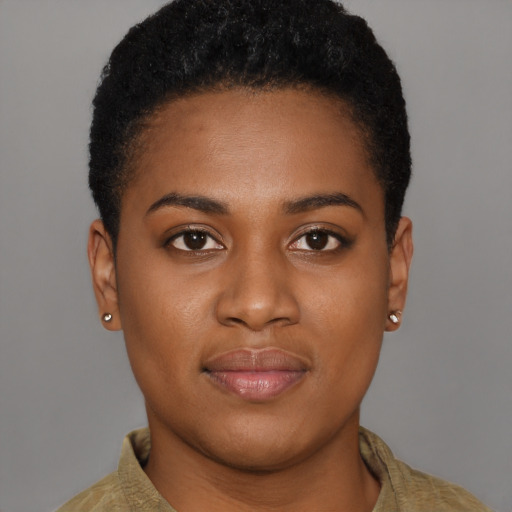 Joyful black young-adult female with short  brown hair and brown eyes