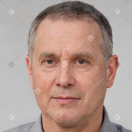 Neutral white middle-aged male with short  gray hair and brown eyes