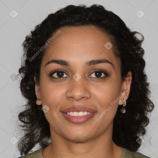 Joyful black young-adult female with long  brown hair and brown eyes