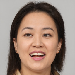 Joyful white young-adult female with medium  brown hair and brown eyes