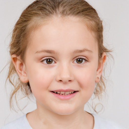 Joyful white child female with medium  brown hair and grey eyes