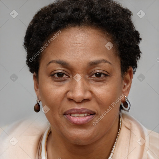 Joyful black adult female with short  brown hair and brown eyes