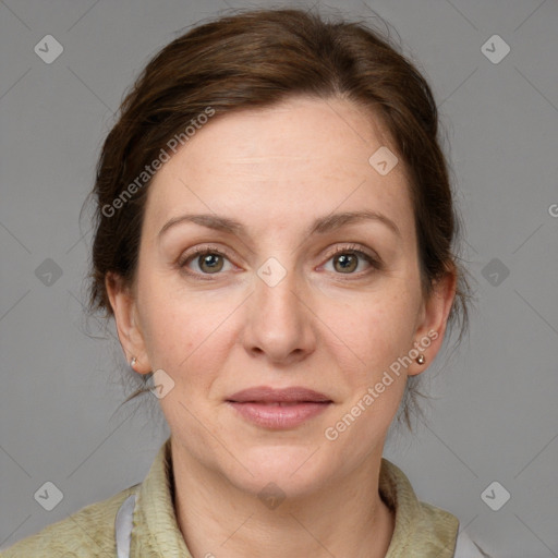 Joyful white adult female with medium  brown hair and grey eyes