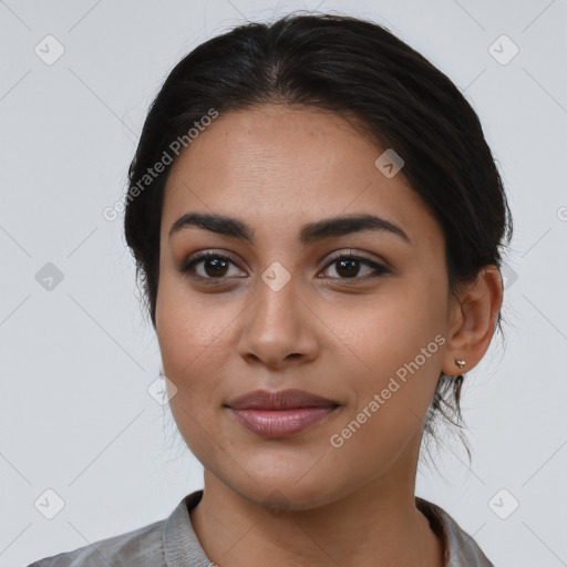 Joyful latino young-adult female with long  black hair and brown eyes