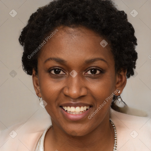 Joyful black young-adult female with short  brown hair and brown eyes