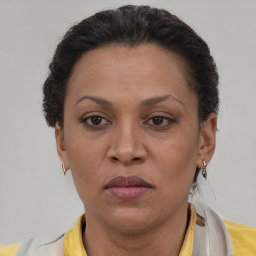 Neutral latino adult female with short  brown hair and brown eyes