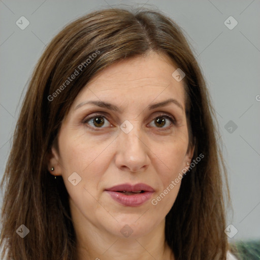 Joyful white adult female with long  brown hair and brown eyes