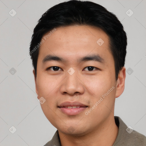 Joyful asian young-adult male with short  black hair and brown eyes