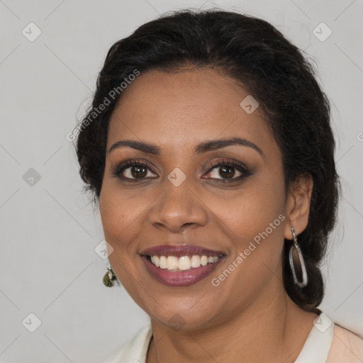 Joyful black young-adult female with long  brown hair and brown eyes